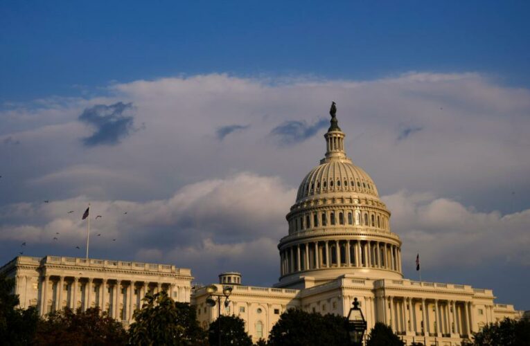 Biden signs into law the stopgap funding resolution as lawmakers turn their attention to negotiating his infrastructure bill