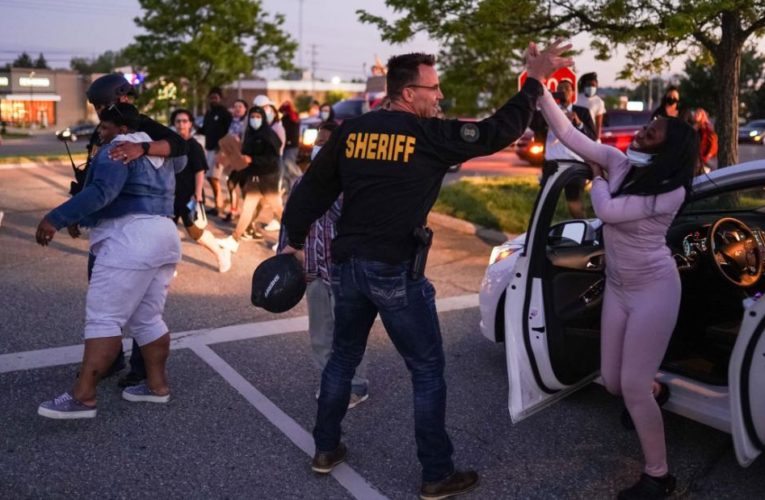 Sheriff lowered his baton to listen to protesters. They said ‘walk with us,’ so he did
