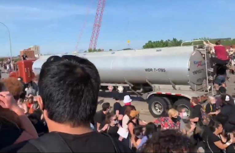 Video shows tractor-trailer drive through protesters