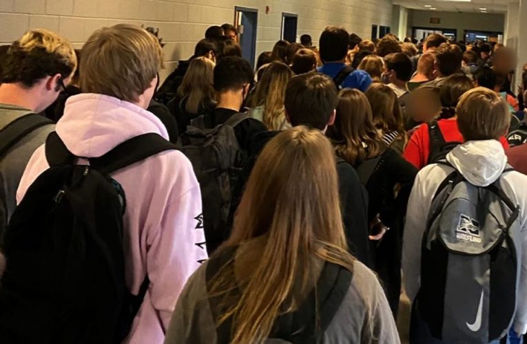 Georgia school seen in photo of a crowded hallway will briefly move to online learning after reporting 9 cases of Covid-19