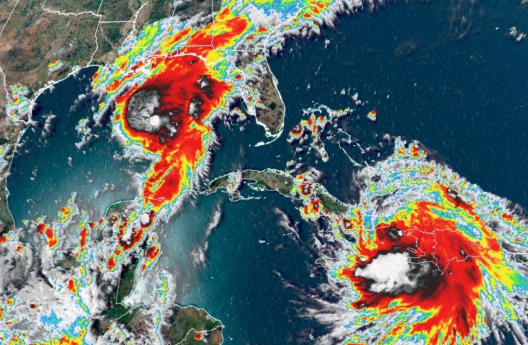 Marco strengthens to a hurricane with Laura close behind