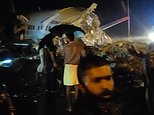 Air India plane with 191 onboard crash lands on runway
