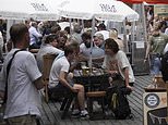 Britain cools off&hellip; but where’s the social distancing? Drinkers pack into beer gardens