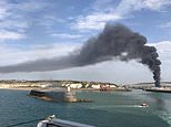 ‘Explosion’ at Sussex port sends thick black smoke cloud that can be seen for miles into the sky