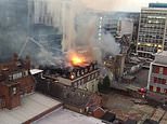 Fire rips through block of flats in Bournemouth as flames are seen leaping from the collapsing roof
