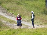 The Queen is seen walking her corgis on Balmoral Estate at Glen Muick