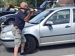 Man smashes car window with an AXE to rescue Yorkshire Terrier