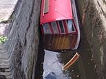 Fire crew saves family after their canal barge gets WEDGED in lock and starts SINKING 