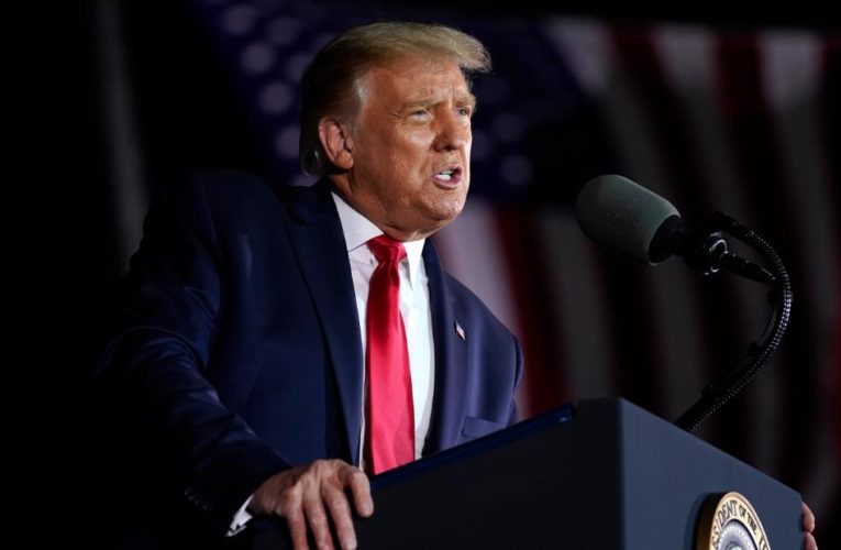 No social distancing and few masks as crowd waits for Trump rally