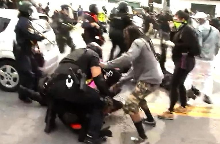 One ex-officer, Brett Hankison, faces a charge related to firing into her home. Demonstrators take to the streets.