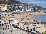 Britons head to beauty spots and beaches as temperatures hit 70F