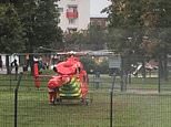 Air ambulance rescues man, 27, fighting for his life after being shot outside primary school
