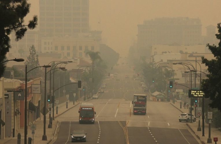Wildfires during pandemic intensify economic pain in West