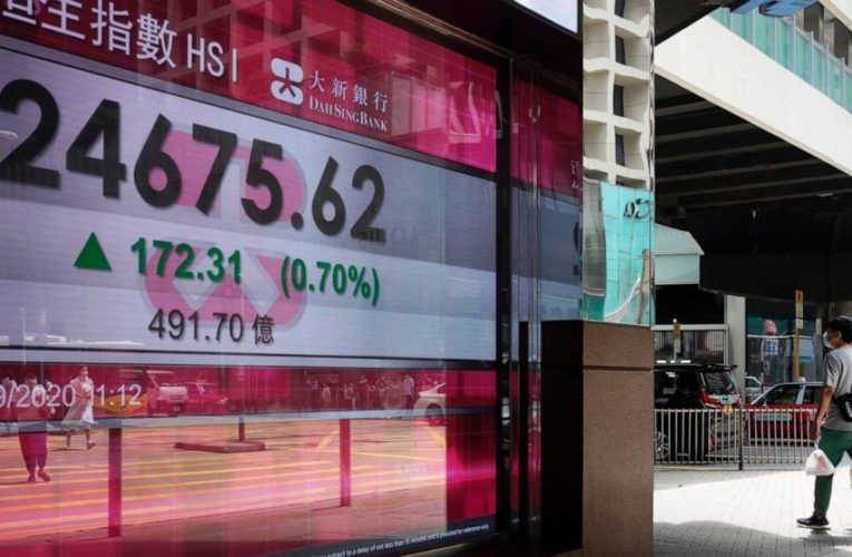 Asian markets mixed after Wall Street rises on dealmaking
