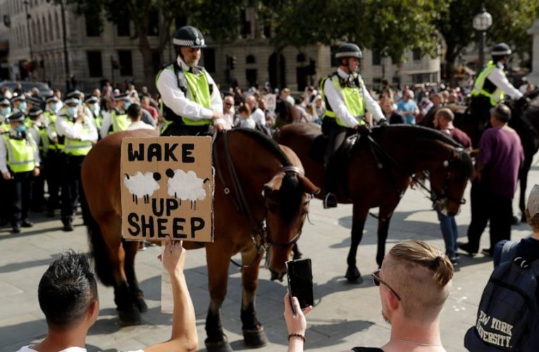 Virus measures targeted by protesters despite case spikes