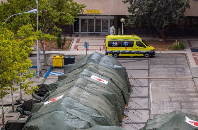 Emergency tents, restrictions back as virus spikes in Madrid