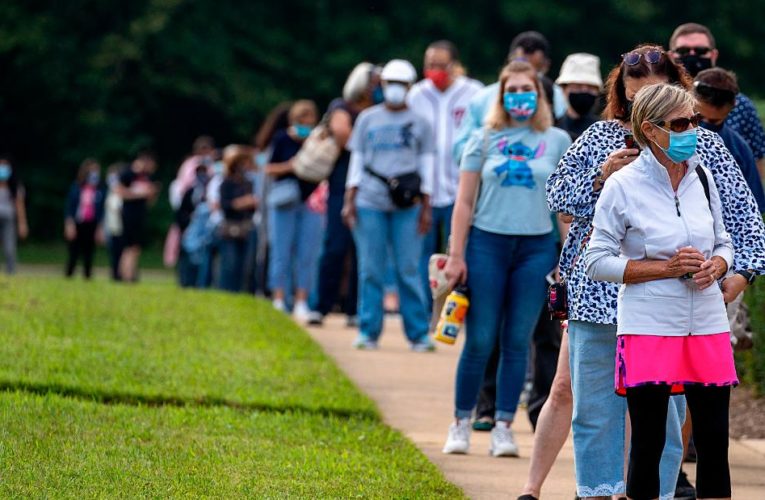 Early voters wait hours in line as states see record turnout