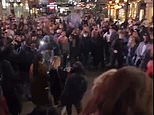 London revellers play cricket in the street as others party in Liverpool and Newcastle
