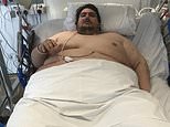 Britain’s 50-stone fattest man is hoisted out of his flat by CRANE