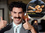 Worker ensures giant inflatable Borat is covered up as he floats down Thames to promote new movie