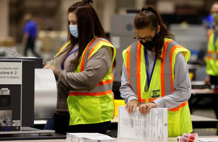 Crush of mail-in ballots slows tally in four battleground states