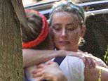 Emotional Amber Heard hugs her family after hearing Johnny Depp verdict