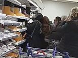Panic-buyers lose their cool: Tesco customers wrestle to get hold of bargains in the chiller aisle