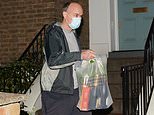Dominic Cummings leaves Downing Street with his belongings in a box