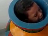 Boy, six, gets trapped in large vase before mother smashes it with a hammer to free him in Brazil 