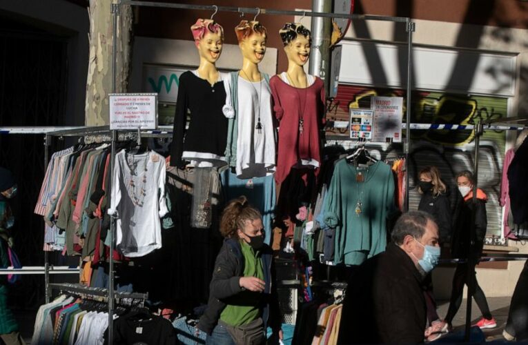 Ancient Madrid market reopens amid debate over virus rules