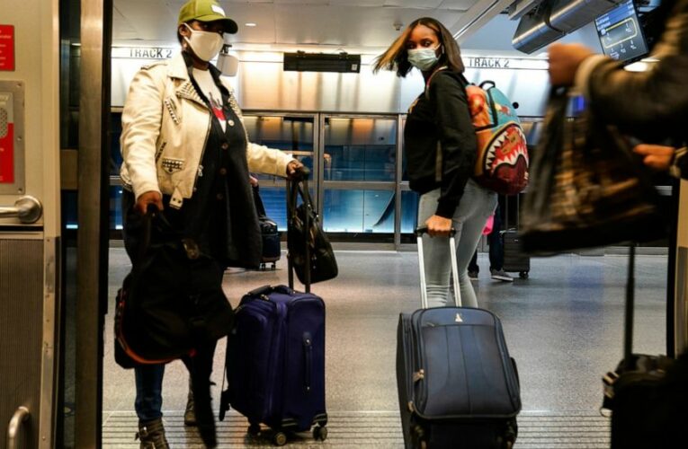 Millions stick to Thanksgiving travel plans despite warnings