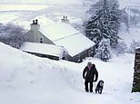 Walkies in a winter wonderland: Britain’s sub-zero chill will last into next week