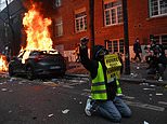 Riots in Paris as furious masked mob set cars on fire and throw Molotov cocktails at police
