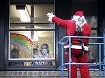Santa Claus swaps his sleigh for a cherry picker as he visits young hospital patients in Leeds 