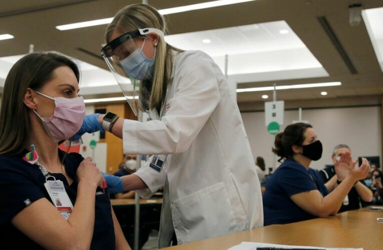 ‘Healing is coming’: US health workers start getting vaccine