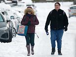 Snow-coated Britain wakes to fresh warning of icy roads and freezing fog