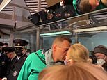 Putin critic Alexei Navalny kisses wife goodbye as he is arrested by Russian police in Moscow