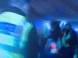 Moment police raid illegal party in marquee with 50 revellers as organiser is hit with £10,000 fine