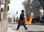 Hundreds of ultra-Orthodox Jews clash with riot cops during anti-lockdown protests in Israel