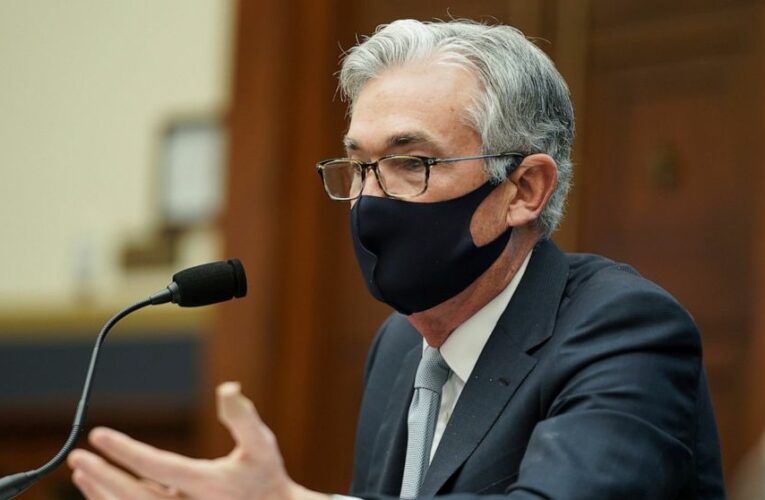 Powell signals Fed will keep aiding economy with bond buying