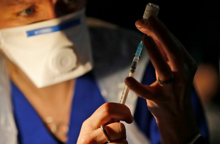 UK vaccination drive expands as virus toll nears 100,000