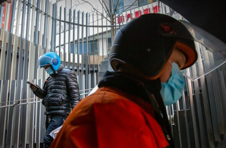 The Latest: Britain’s Johnson talks lockdown, hospital surge