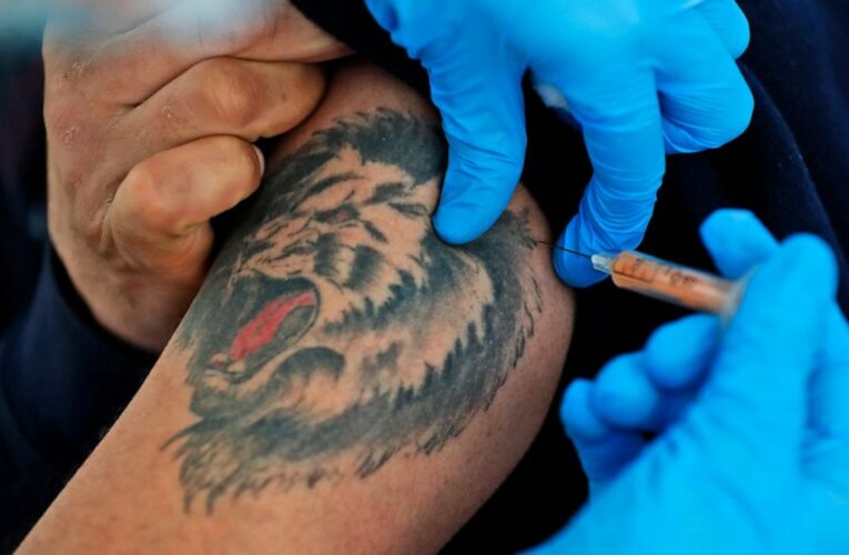 The Latest: Portugal starts giving firefighters vaccine jabs