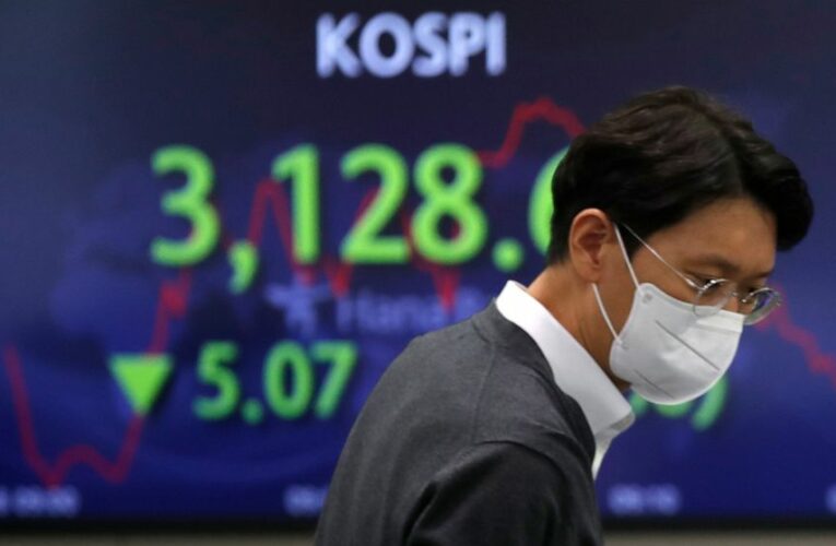 World shares mostly lower after mixed day on Wall Street
