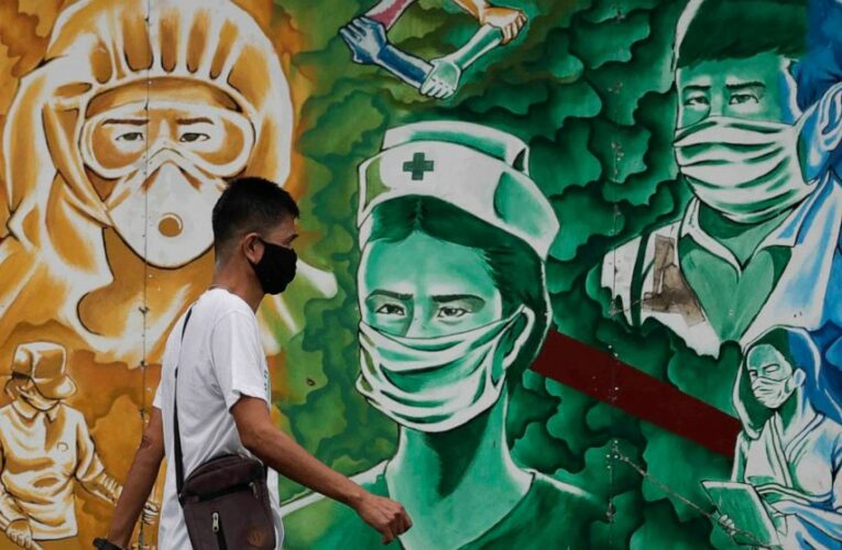 The Latest: COVID-19 hospitalizations plummet after jabs