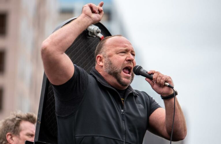 Police are investigating an allegation that the conspiracy theorist threatened to push a ‘March for Trump’ official off an event stage