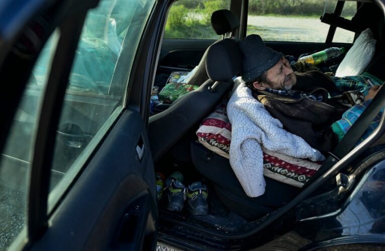 AP PHOTOS: Cars become home for Spain’s pandemic casualties