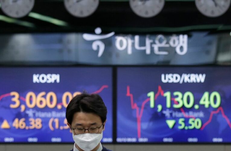 Stocks mostly shake off a weak start, edge to more records