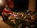 Defiant mourners continue to travel to Buckingham Palace to pay respects to Prince Philip