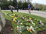 Defiant mourners continue to travel to Buckingham Palace to pay respects to Prince Philip
